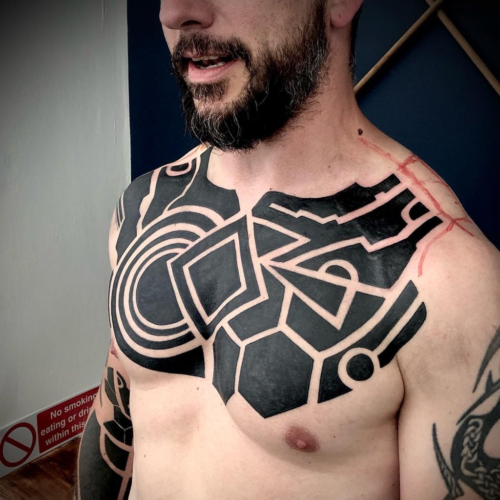 Thinking of Getting a Sacred Geometry Tattoo? 12 Blackwork geometric tattoo using solid black and negative space